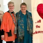 Joanie after speaking at one heart women's conference with other women attendees